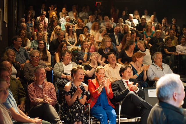 People clapping at the TBG Annual Fundraiser, May 2016